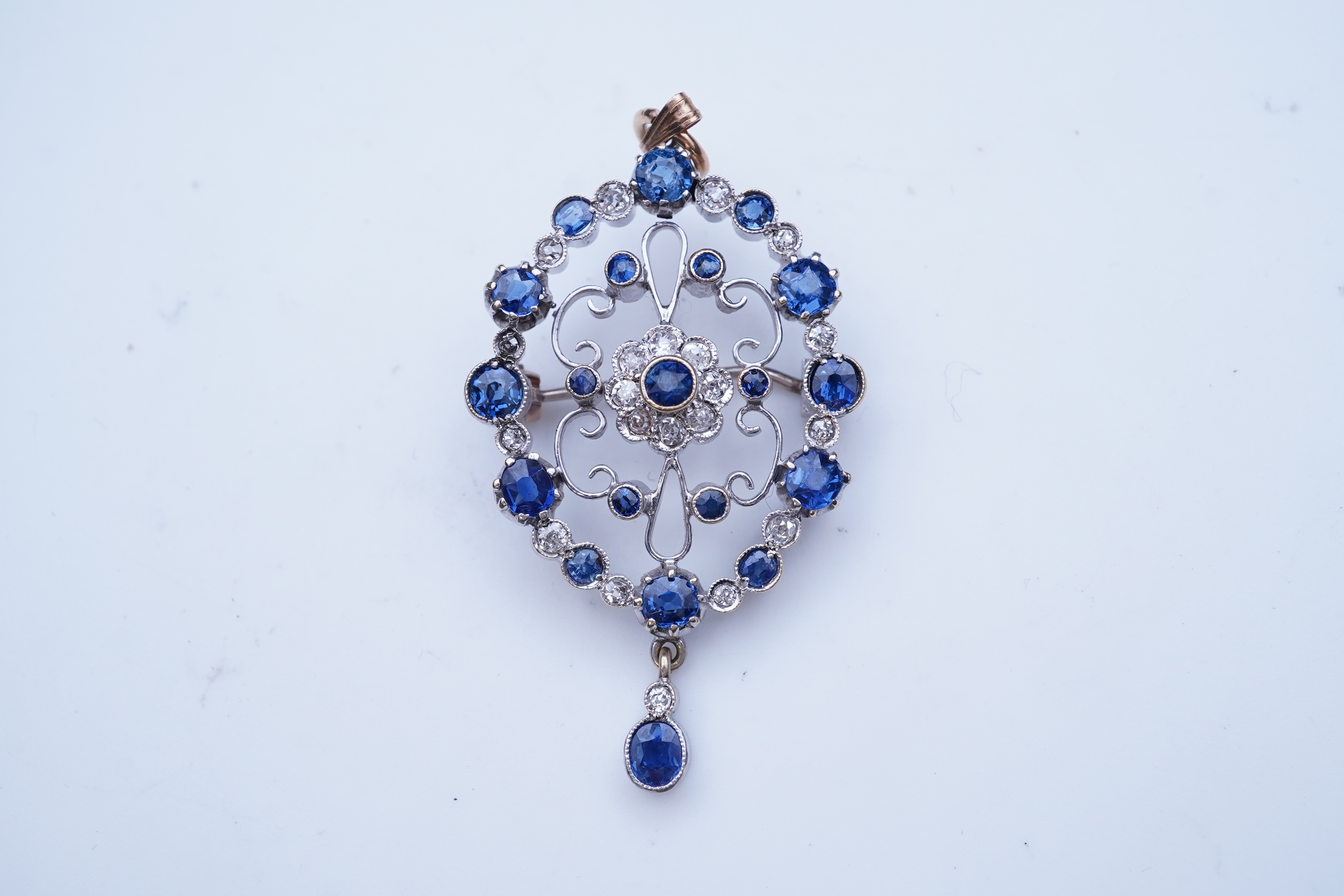 A sapphire and diamond brooch/pendant, mid 20th century